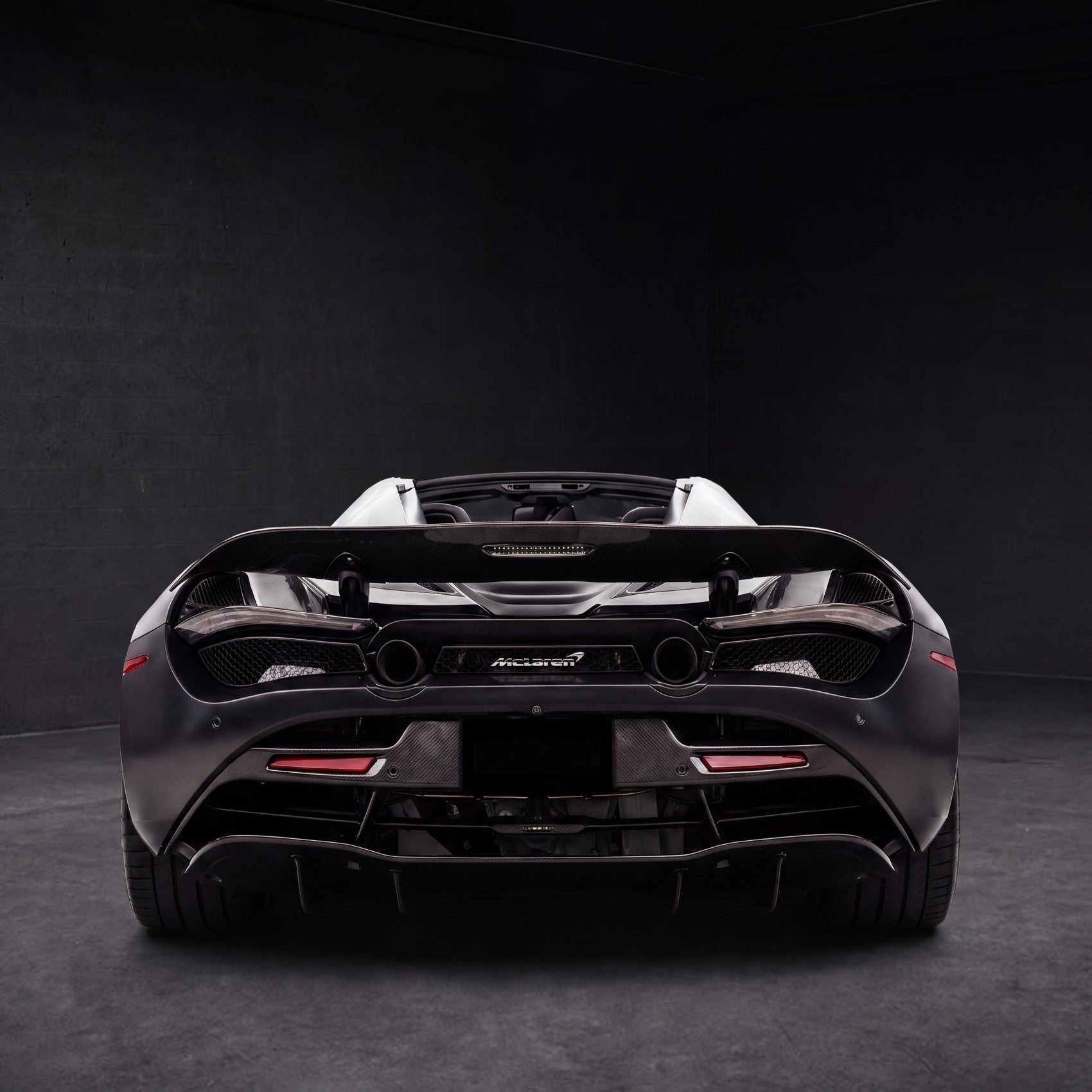 McLaren 720S Spider Convertible | black backdrop | view 04 | source hf_20260513_203719_4056549f-cbc0-47fd-ac61-fe8b900fb5d4 - 1x1.png