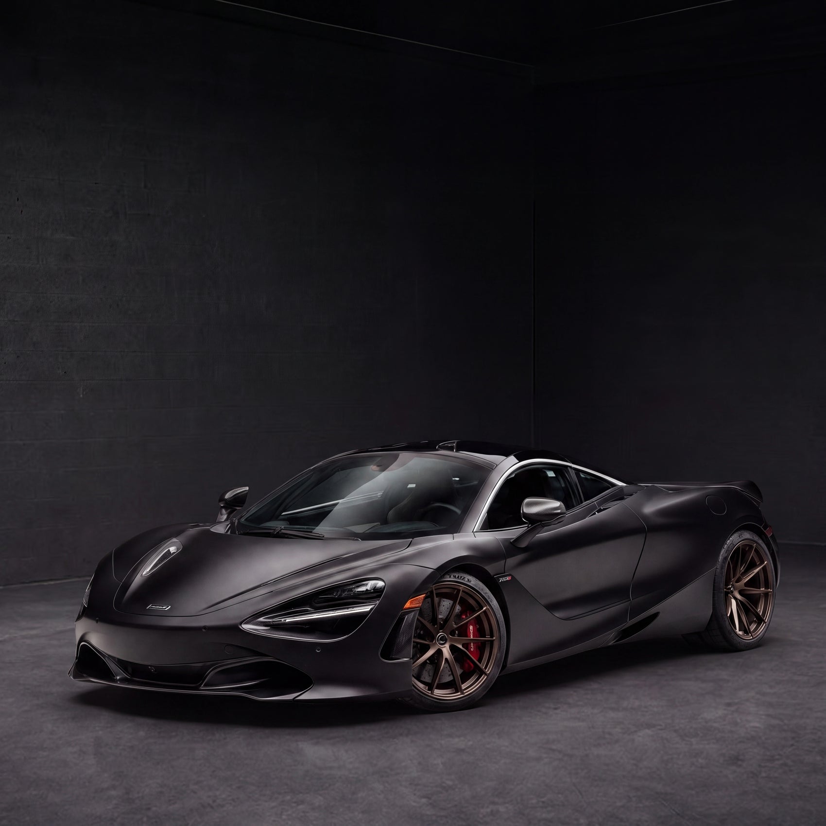 McLaren 720S Spider Convertible | black backdrop | view 12 | source mclaren-720s-spider-convertible-roof-down - 1x1.png