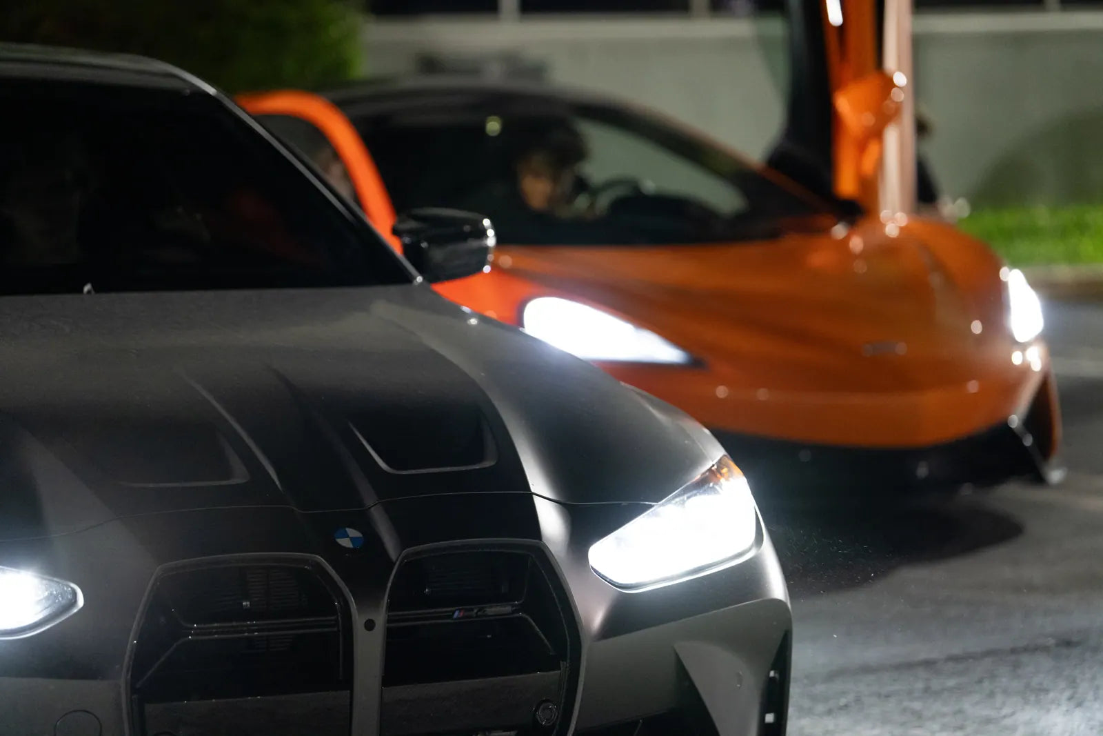 BMW M4 and McLaren headlights in the Ark lot