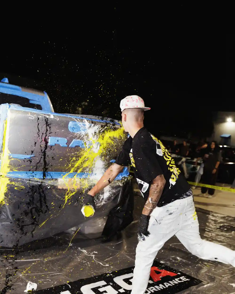 Guest painting a car during Cars and Cameras at Ark